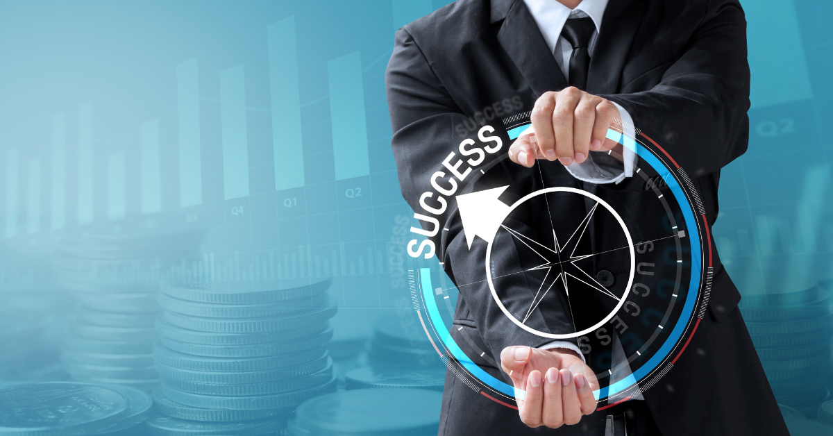 A man in a n=business suit holding up a holographic compass with its arrow pointing to the word "success".