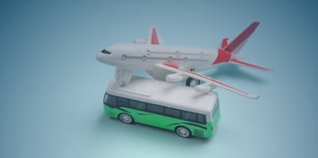 A toy airplane and a bus on a blue background, illustrating the significance of FIFO, DIDO, and BIBO models in modern work environments.