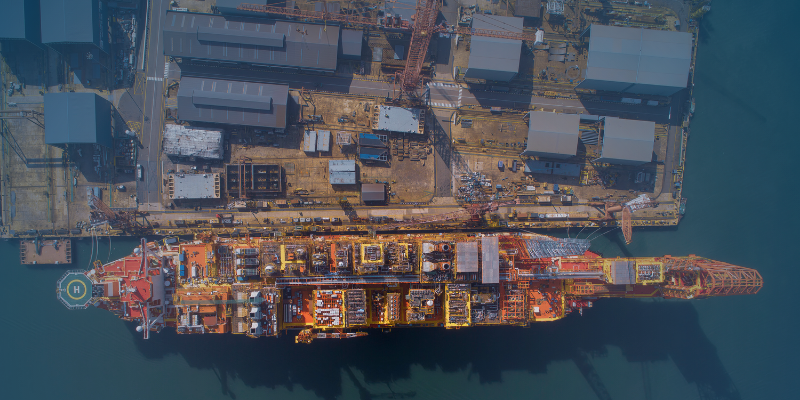 An FLNG facility docked at a specialised shipyard before deployment