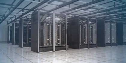 Interior of a modern data centre with rows of server racks, showing critical IT infrastructure 