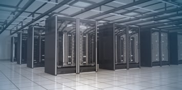 Interior of a modern data centre with rows of server racks, showing critical IT infrastructure 