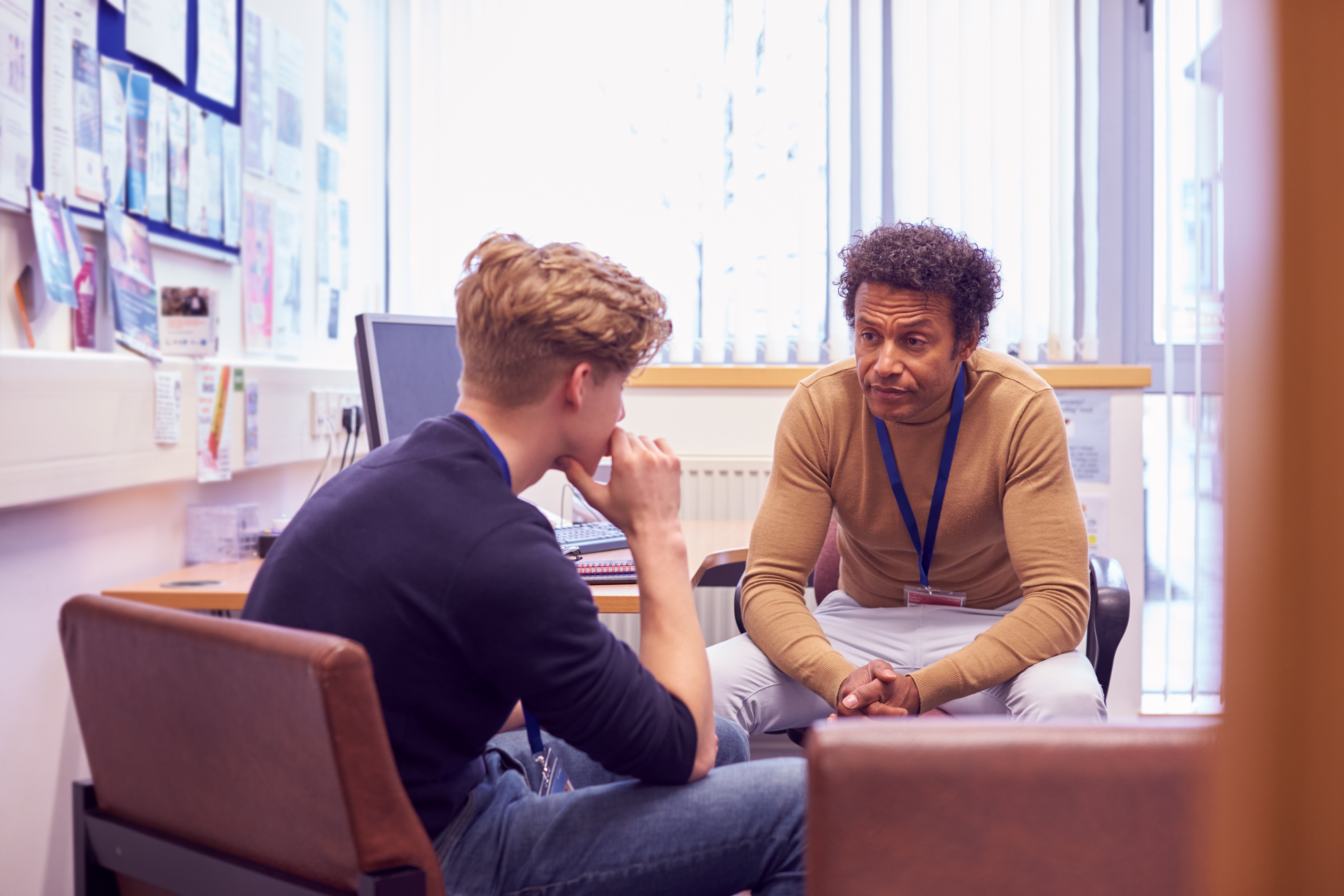 Male Meeting With Counselor Discussing Mental Health Issues