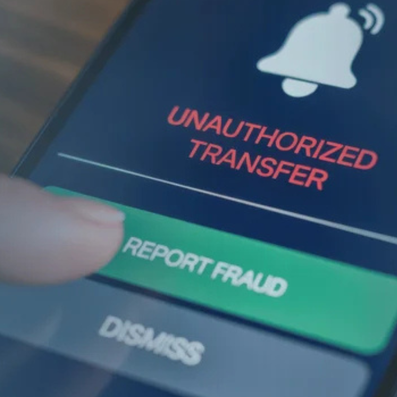 zoomed in on a phone with an index finger selecting report fraud
