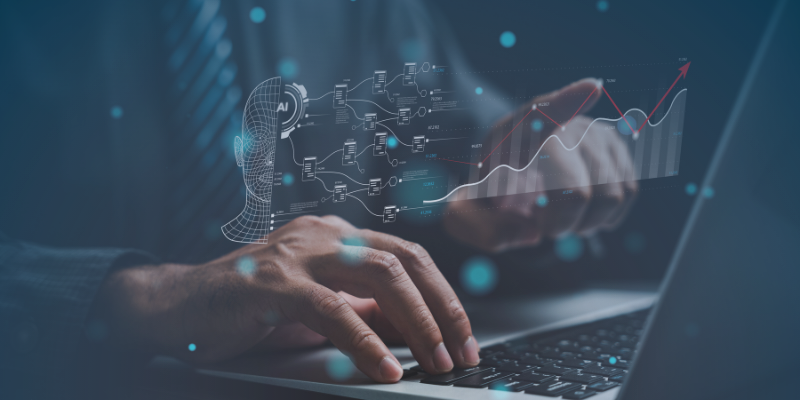 Professional man using a laptop to review graphs and business data, illustrating AI's role in enhancing workplace skills.