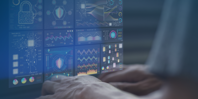 An individual engages with a computer screen showcasing multiple data sets and analytical information.